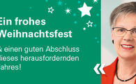 Ein Portrait einer mittelalten, kurzhaarigen Frau mit dem Text "Ein frohes Weihnachtsfest & einen guten Abschluss dieses herausfordernden Jahres!" auf der linken Seite.